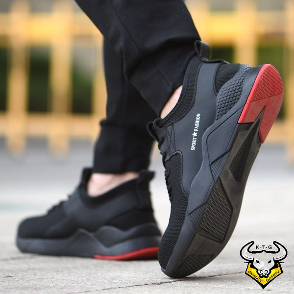 Model wearing KTG Safety Steel Toe Sports Safety Shoes Model SS47 - Knitted Mesh Black Red Sole - Kevlar anti smash display